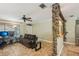 Inviting living room with a ceiling fan, tiled floor, and warm neutral paint at 4468 Maraldo Ave, North Port, FL 34287