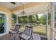 Relaxing screened patio with comfortable seating and backyard views at 4468 Maraldo Ave, North Port, FL 34287