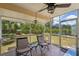 Relaxing screened patio with comfortable seating and view of backyard at 4468 Maraldo Ave, North Port, FL 34287