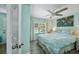 Light-filled bedroom with ceiling fan, and window with decorative curtains, with a tropical themed decor at 4695 86Th N Ave, Pinellas Park, FL 33782