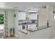 Bright kitchen with white cabinets, granite counters, stainless steel appliances, and a breakfast bar at 4695 86Th N Ave, Pinellas Park, FL 33782