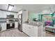 Stylish kitchen with stainless steel appliances and granite counters, open to living area at 4695 86Th N Ave, Pinellas Park, FL 33782
