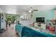 Open concept living space featuring neutral paint, ceiling fan, dining area and views to the kitchen at 4695 86Th N Ave, Pinellas Park, FL 33782