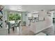 Open-concept living space combines dining and kitchen area with modern appliances and tranquil views of the back yard at 4695 86Th N Ave, Pinellas Park, FL 33782