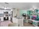 Cozy living space featuring a kitchen and a living room with bright, cheerful decor and lots of natural light at 4695 86Th N Ave, Pinellas Park, FL 33782