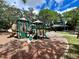A community playground with colorful slides, climbing features, and a nearby pavilion at 4695 86Th N Ave, Pinellas Park, FL 33782