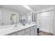 Elegant bathroom featuring a double vanity with marble countertop, a shower, and ample natural light at 5033 Rocky Coast Pl, Palmetto, FL 34221