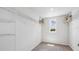 Spacious walk-in closet with ample shelving and a window, perfect for organized storage at 5033 Rocky Coast Pl, Palmetto, FL 34221