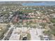 Beautiful aerial view of a residential community, showcasing lush greenery, a pond, and waterfront views at 5039 Kestral Park Dr # 67, Sarasota, FL 34231