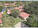 Beautiful aerial view of the property, highlighting the lush landscaping, pond, and private setting at 5039 Kestral Park Dr # 67, Sarasota, FL 34231