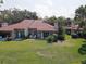 Aerial view of a backyard with a manicured lawn and outdoor seating for relaxation and entertainment at 5039 Kestral Park Dr # 67, Sarasota, FL 34231