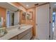Bright bathroom with a double sink vanity, ample lighting, and a well-maintained appearance at 5039 Kestral Park Dr # 67, Sarasota, FL 34231