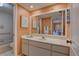 Bathroom featuring a spacious vanity with ample storage and a large mirror for getting ready at 5039 Kestral Park Dr # 67, Sarasota, FL 34231