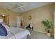 Neutral bedroom with access to en suite bathroom, ample natural light, and a cozy reading nook at 5039 Kestral Park Dr # 67, Sarasota, FL 34231