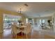 Open-concept dining and living area filled with natural light and stylish furnishings at 5039 Kestral Park Dr # 67, Sarasota, FL 34231