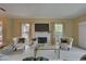 Cozy living room with a marble fireplace, built-in cabinets, and comfortable seating for relaxing and entertaining at 5039 Kestral Park Dr # 67, Sarasota, FL 34231