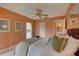 Neutral-toned main bedroom offering a ceiling fan, plush carpet, and a bright, airy feel at 5039 Kestral Park Dr # 67, Sarasota, FL 34231