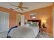Cozy main bedroom with a ceiling fan, closet, and neutral tones for a relaxing atmosphere at 5039 Kestral Park Dr # 67, Sarasota, FL 34231