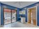 Sunlit office space with a built-in desk and access to a private outdoor patio at 5039 Kestral Park Dr # 67, Sarasota, FL 34231
