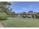 Scenic water view featuring a pond with a fountain and manicured green space in a tranquil setting at 5039 Kestral Park Dr # 67, Sarasota, FL 34231