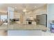 Bright kitchen showcasing granite counters, white cabinetry, modern appliances, and a stylish backsplash at 5386 Creekside Trl, Sarasota, FL 34243