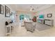 Spacious living room with tile flooring, tray ceiling, and sliding glass doors to patio at 5386 Creekside Trl, Sarasota, FL 34243