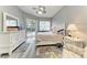 Serene main bedroom features a walkout to the pool, calming gray walls, and hardwood floors at 5386 Creekside Trl, Sarasota, FL 34243