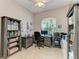 Well-lit home office space with built-in shelving and a large window view at 5386 Creekside Trl, Sarasota, FL 34243