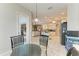 Open-concept design seamlessly connects the breakfast nook, kitchen, and living area creating a spacious feel at 5386 Creekside Trl, Sarasota, FL 34243
