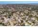 Scenic aerial view of a residential area with lush greenery, well-maintained streets, and glimpses of waterfront at 5403 2Nd W Ave, Bradenton, FL 34209