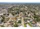Expansive aerial view of a residential neighborhood showcasing tree-lined streets and diverse home styles at 5403 2Nd W Ave, Bradenton, FL 34209