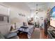 Cozy bedroom with wood floors, ceiling fan, and ensuite bathroom at 5403 2Nd W Ave, Bradenton, FL 34209