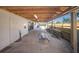 Covered carport with ample space, wooden beams, and a view of the neighborhood at 5403 2Nd W Ave, Bradenton, FL 34209
