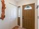 Inviting entryway featuring a decorative front door, closet, and hardwood floors at 5403 2Nd W Ave, Bradenton, FL 34209