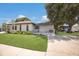 Inviting one-story home with a green lawn, clean exterior, and a cozy front porch, ideal for a relaxed lifestyle at 5403 2Nd W Ave, Bradenton, FL 34209