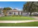 Beautiful single-story house with a well-kept lawn, bright exterior paint, and a welcoming front porch area at 5403 2Nd W Ave, Bradenton, FL 34209