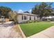 Inviting single-story home with a bay window, lush lawn, and a charming front porch, perfect for relaxing outdoors at 5403 2Nd W Ave, Bradenton, FL 34209