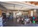 Spacious garage featuring ample storage, a golf cart, and a water heater at 5403 2Nd W Ave, Bradenton, FL 34209