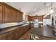 Kitchen with a long countertop, ample cabinet space, a double sink, and appliances including a microwave and oven at 5403 2Nd W Ave, Bradenton, FL 34209
