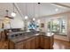 Open kitchen overlooking the living area, featuring pendant lights, a breakfast bar, and a window seat at 5403 2Nd W Ave, Bradenton, FL 34209