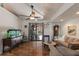 Living room with hardwood floors, aquarium, stained glass window decor, and sliding glass doors to the exterior at 5403 2Nd W Ave, Bradenton, FL 34209