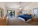 Comfortable main bedroom featuring outdoor access and a ceiling fan at 5403 2Nd W Ave, Bradenton, FL 34209