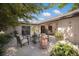 Private patio with outdoor seating, lush landscaping, and sliding glass doors to the home at 5403 2Nd W Ave, Bradenton, FL 34209