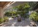 Expansive patio overlooking the lush backyard with mature trees and comfortable seating arrangement at 5403 2Nd W Ave, Bradenton, FL 34209