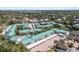 Aerial view of community featuring pool, covered parking, manicured landscaping and close proximity to waterways at 5623 Midnight Pass Rd # 615, Sarasota, FL 34242