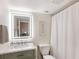 Bathroom with a new vanity, modern lighting, and updated finishes at 5623 Midnight Pass Rd # 615, Sarasota, FL 34242