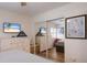Bedroom view with mirrored closet doors, dresser with a TV, and ceiling fan at 5623 Midnight Pass Rd # 615, Sarasota, FL 34242