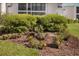 Well-maintained landscaping with vibrant flowers and manicured bushes surrounding the building at 5623 Midnight Pass Rd # 615, Sarasota, FL 34242
