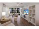 Bright living room featuring hardwood floors, stylish furnishings, and natural light at 5623 Midnight Pass Rd # 615, Sarasota, FL 34242