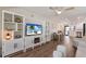 Open-concept living room flowing into dining area and kitchen at 5623 Midnight Pass Rd # 615, Sarasota, FL 34242